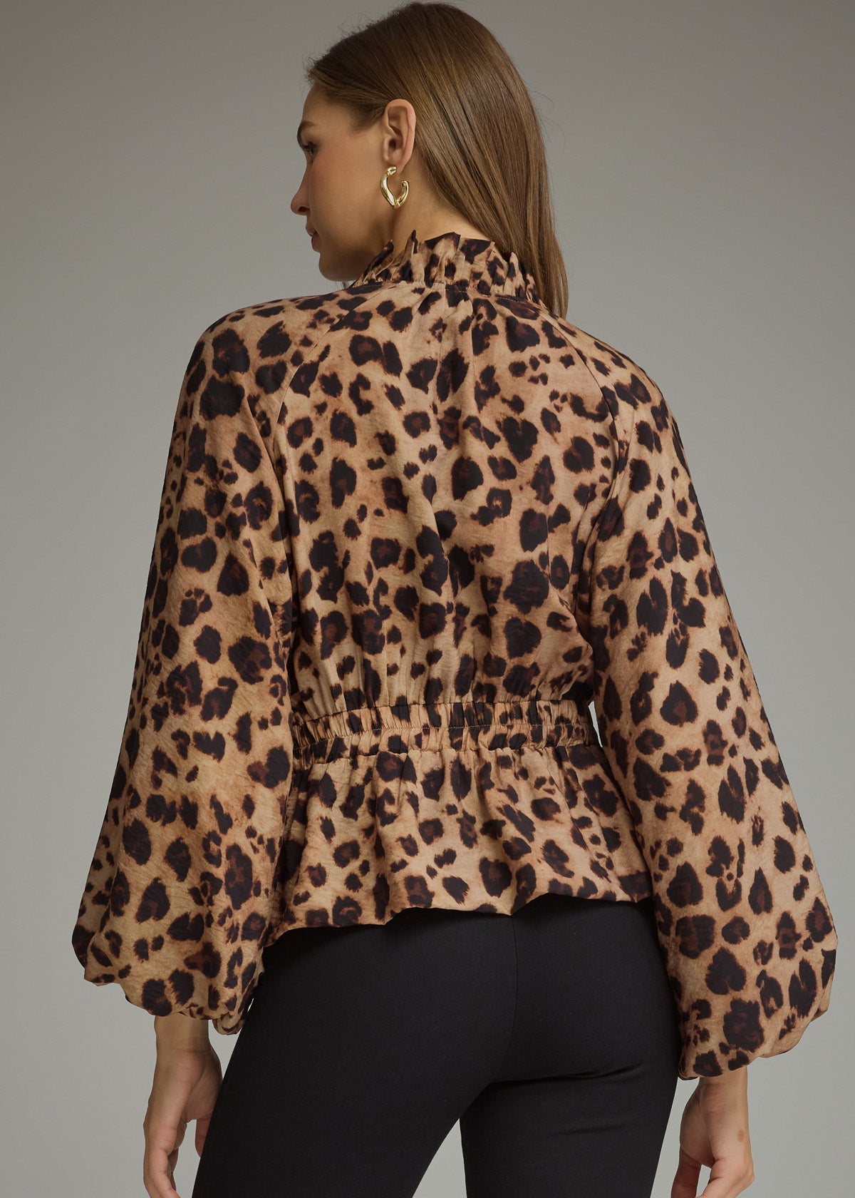 women showing the back of leopard jacket