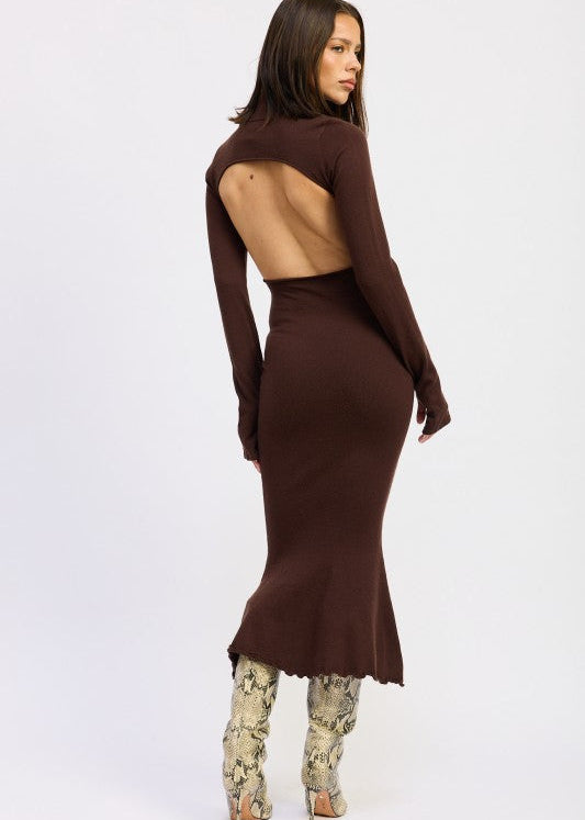 Woman wearing a brown long-sleeve dress with cut-out back on a white background