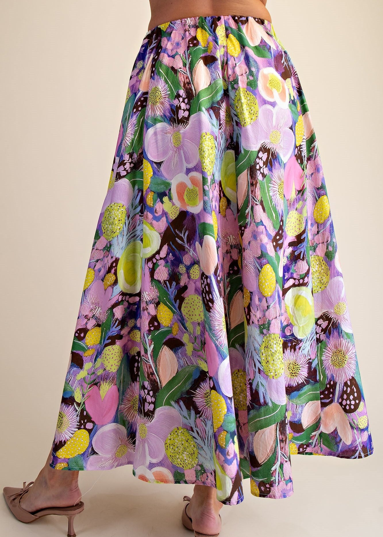 women wearing purple pink floral aline skirt