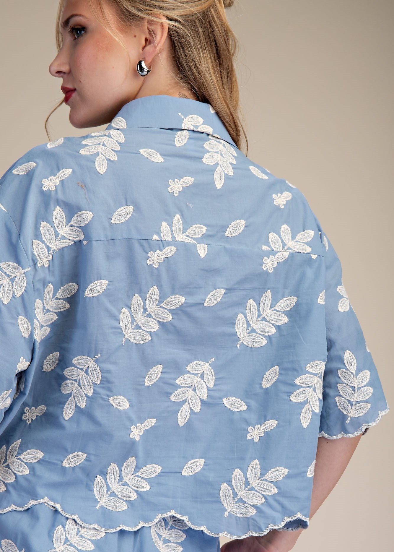 back of women wearing cotton embroidered collared shirt