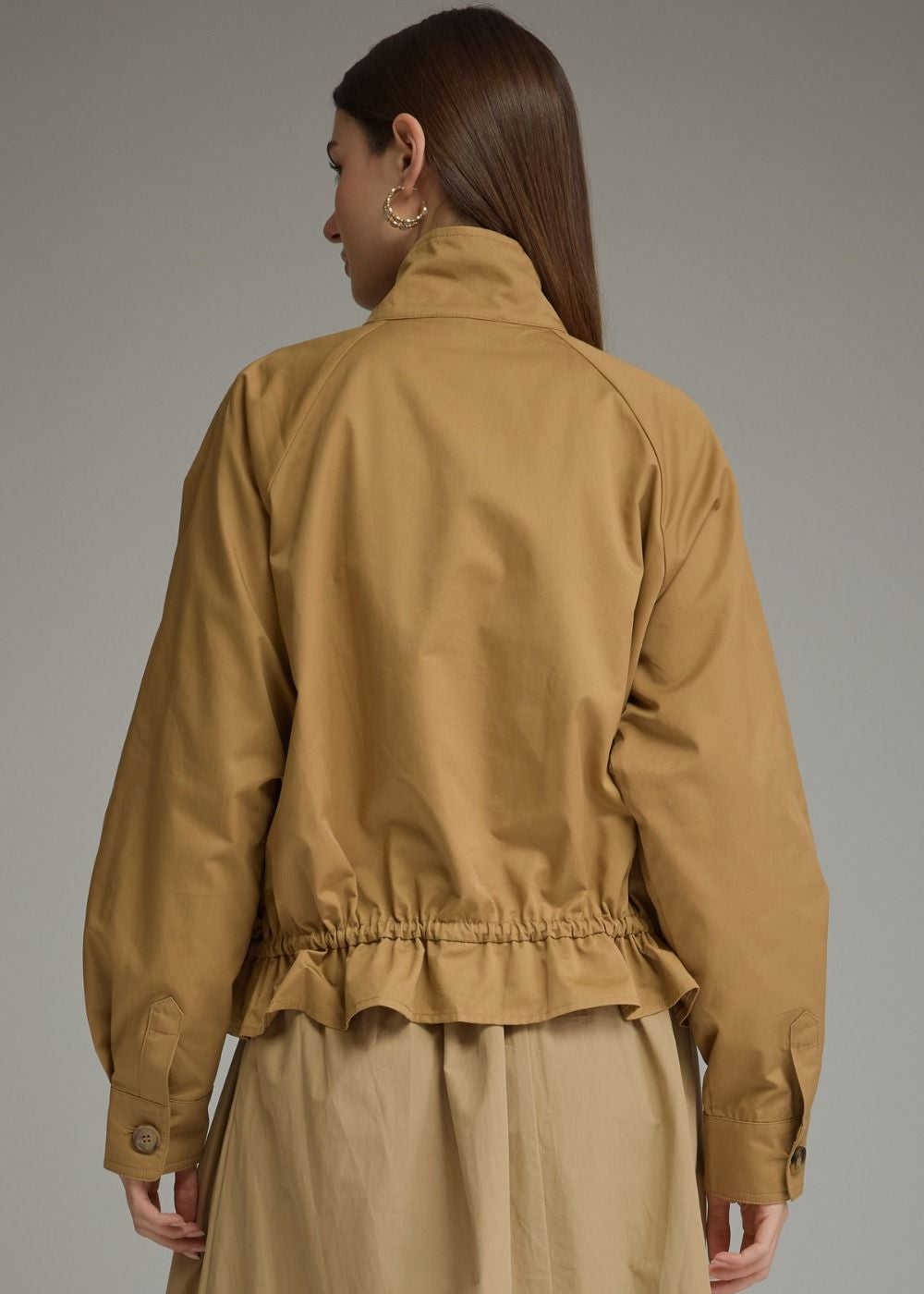 back view of women wearing high neck jacket