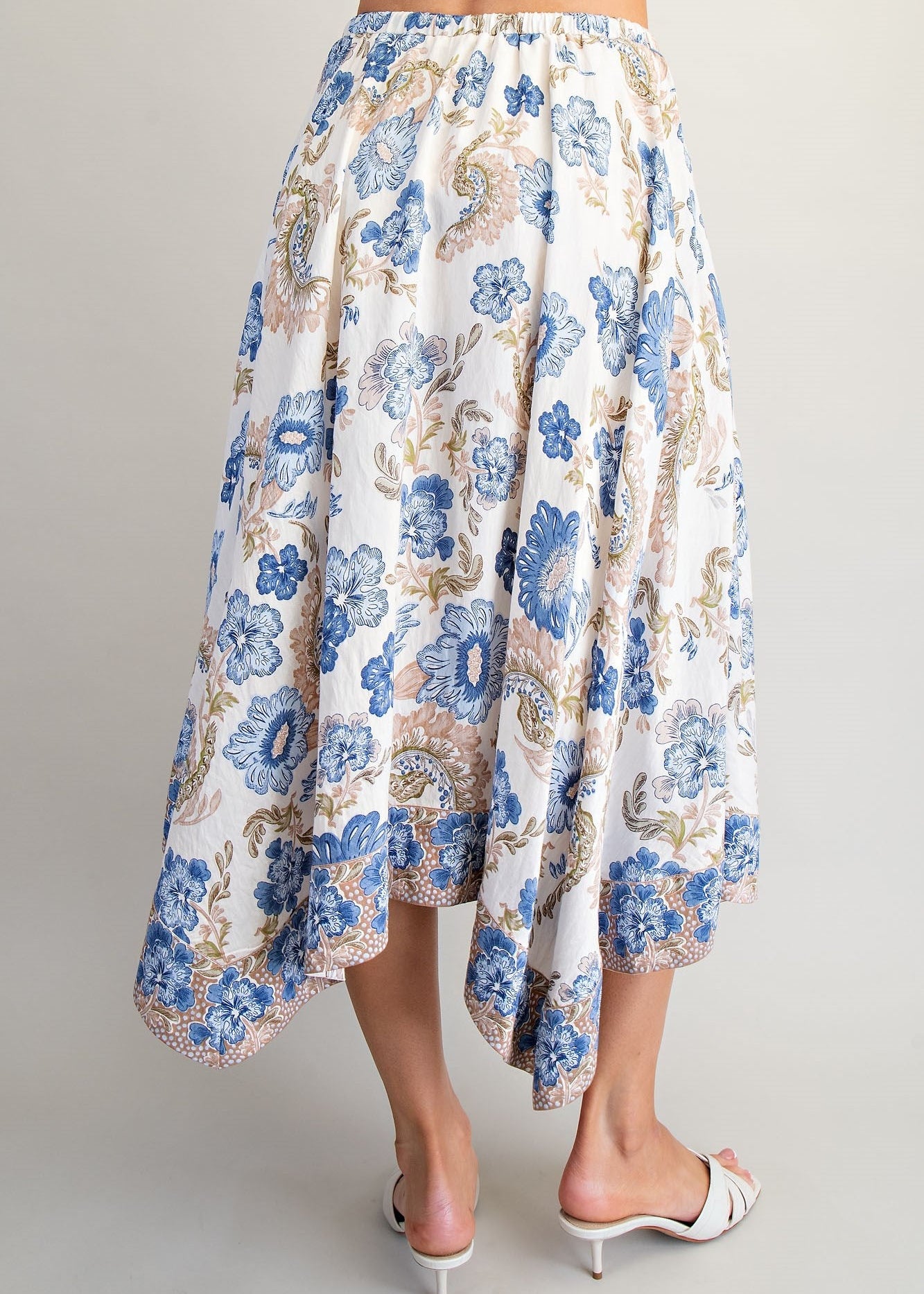 women wearing paisley floral skirt