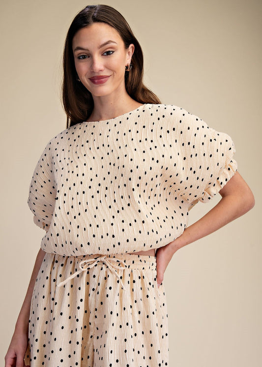 women wearing ballon polka dot blouse with matching wide leg pants