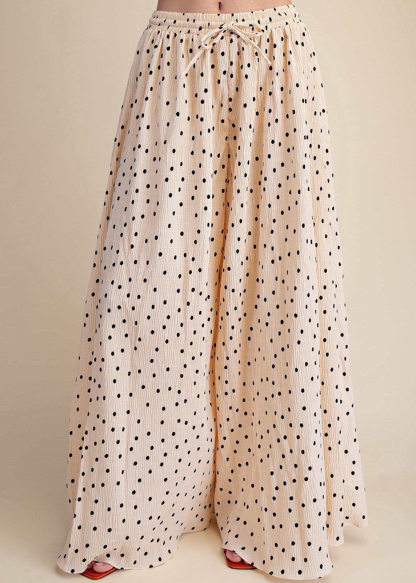 women wearing drawstring wide leg pants  with a polka dot