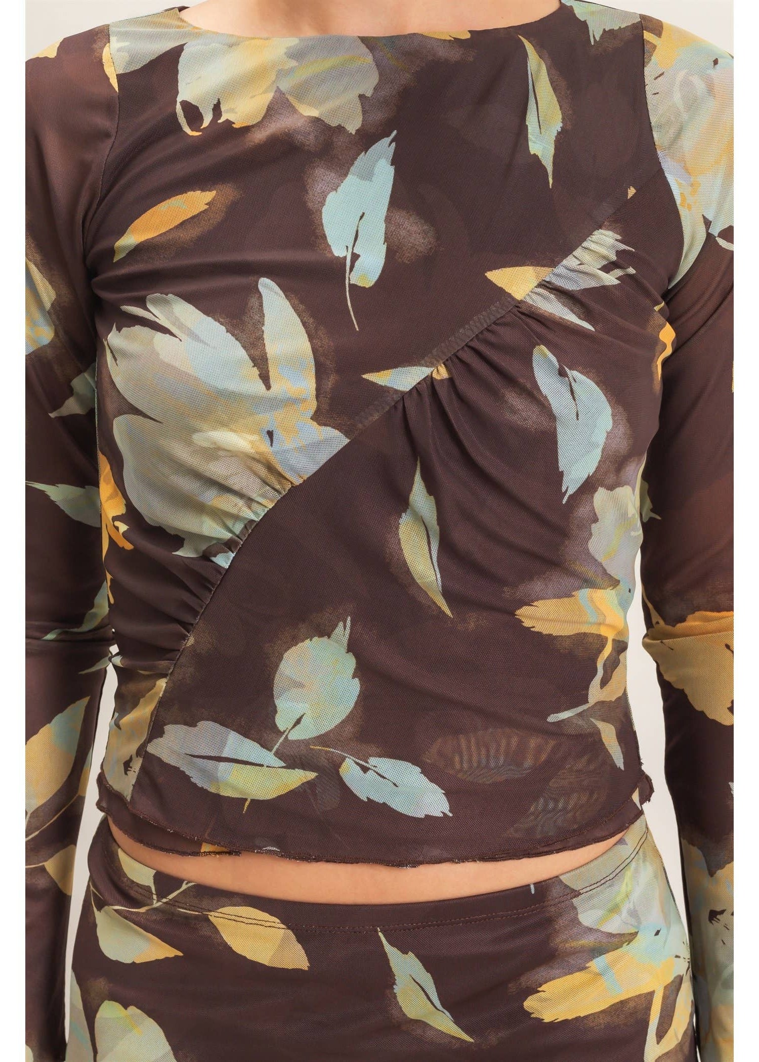 women wearing mesh brown floral top with cream flowers