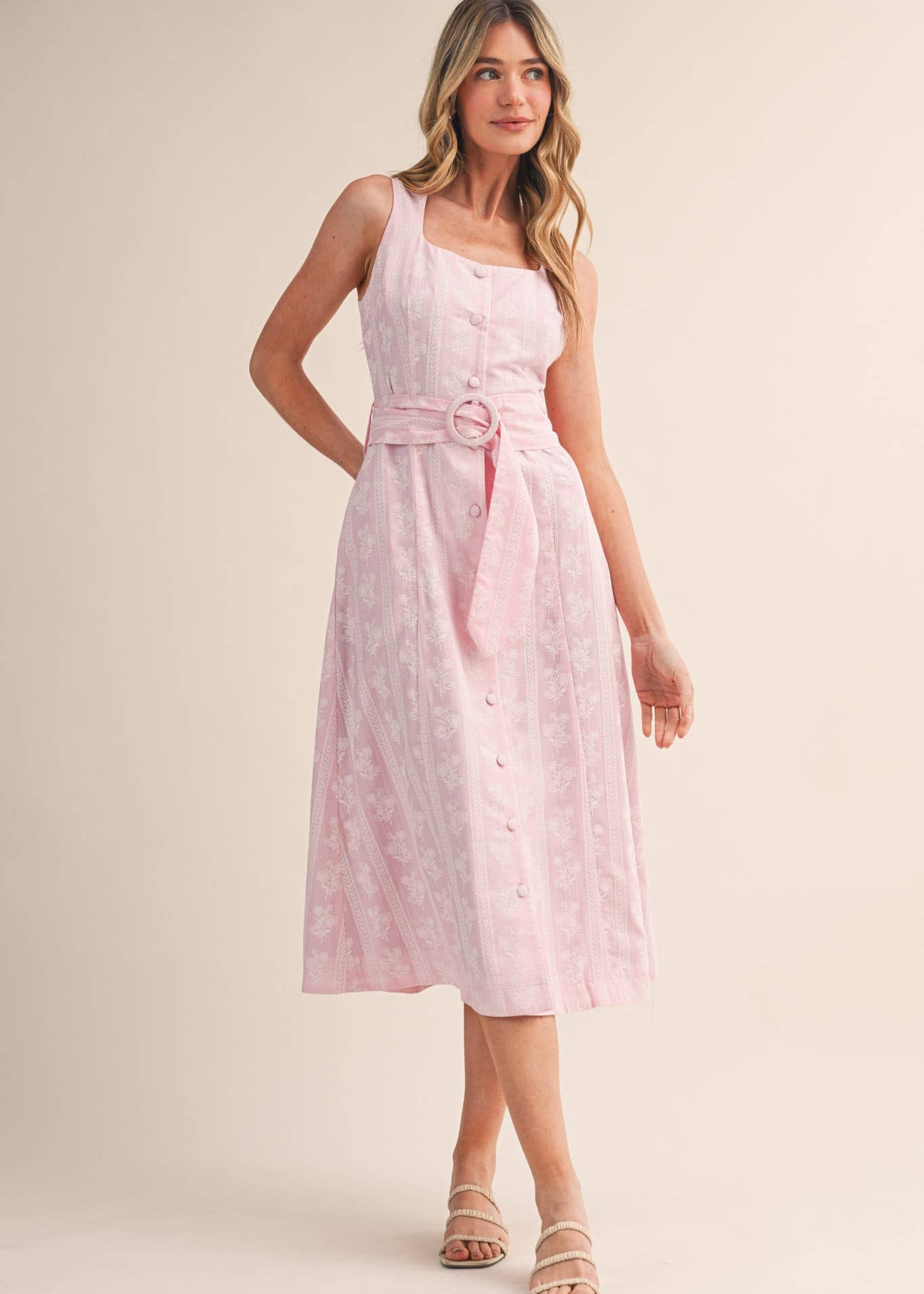 Women wearing scoop neck button down belted floral dress mid length and sleeveless
