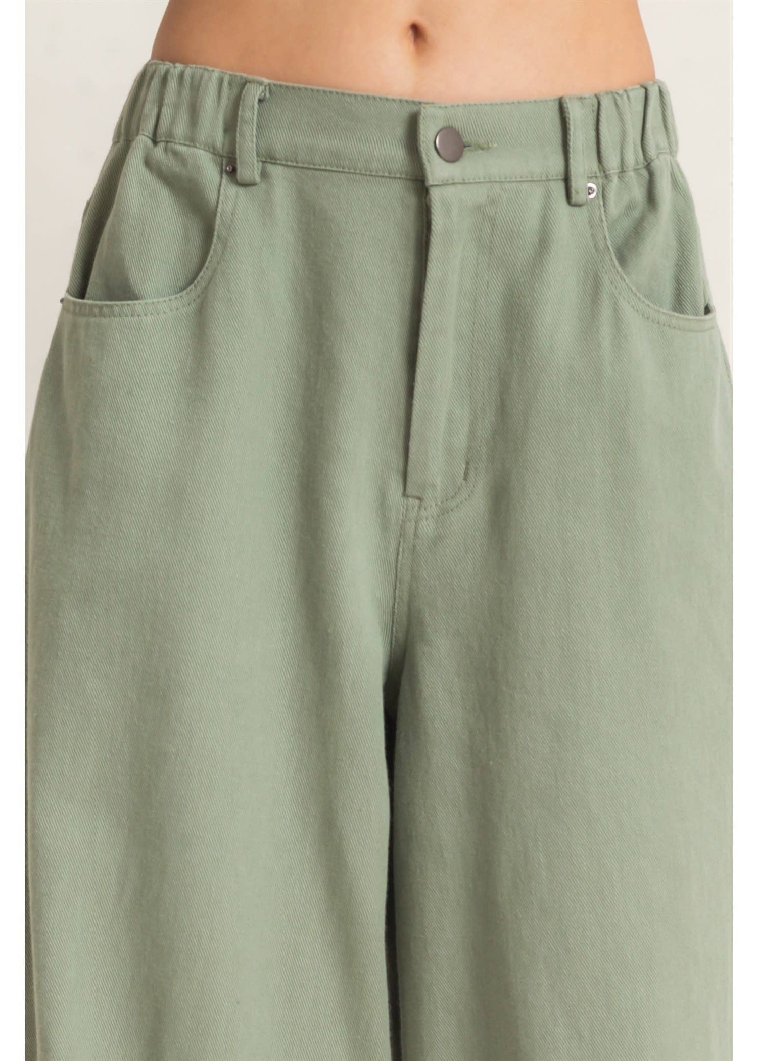 a picture of the front of olive pants 