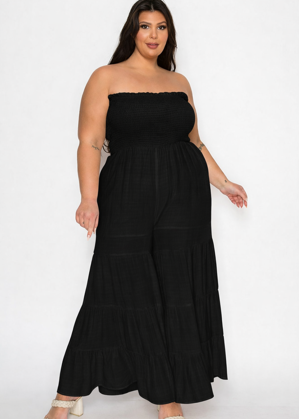 plus size women wearing black smocked jumosuite