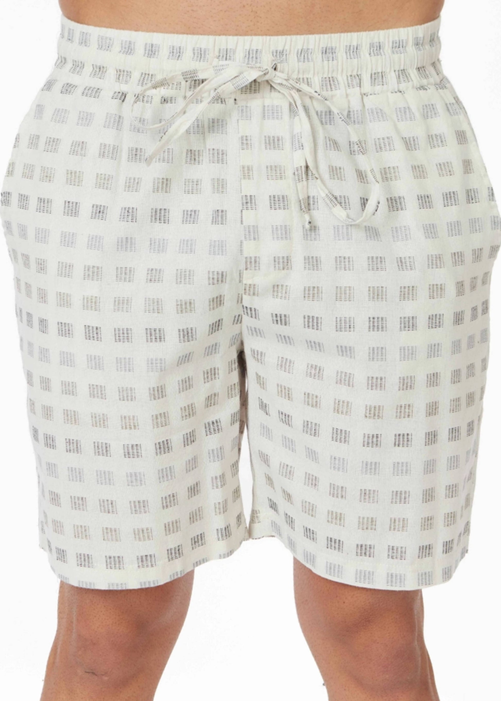close up of mans white textured shorts