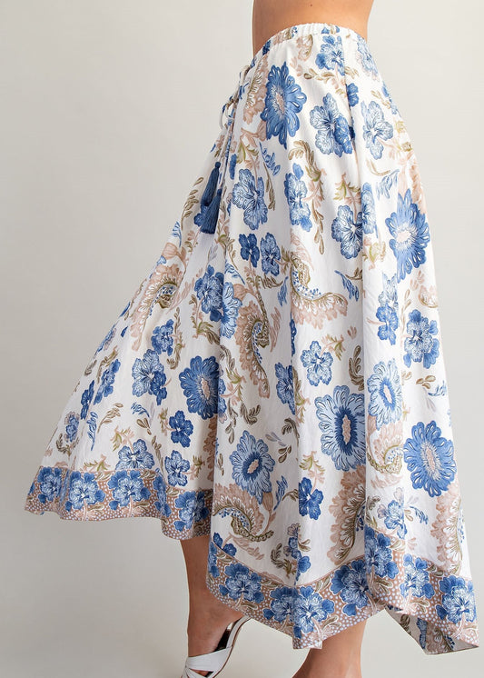 women wering paisley and floral print skirt