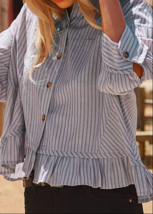 women wearing striped button up blouse with ruffle trim at bottom of blouse