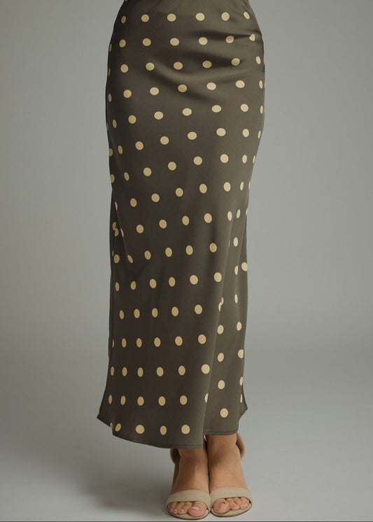 women wearing maxi green polka dot skirt