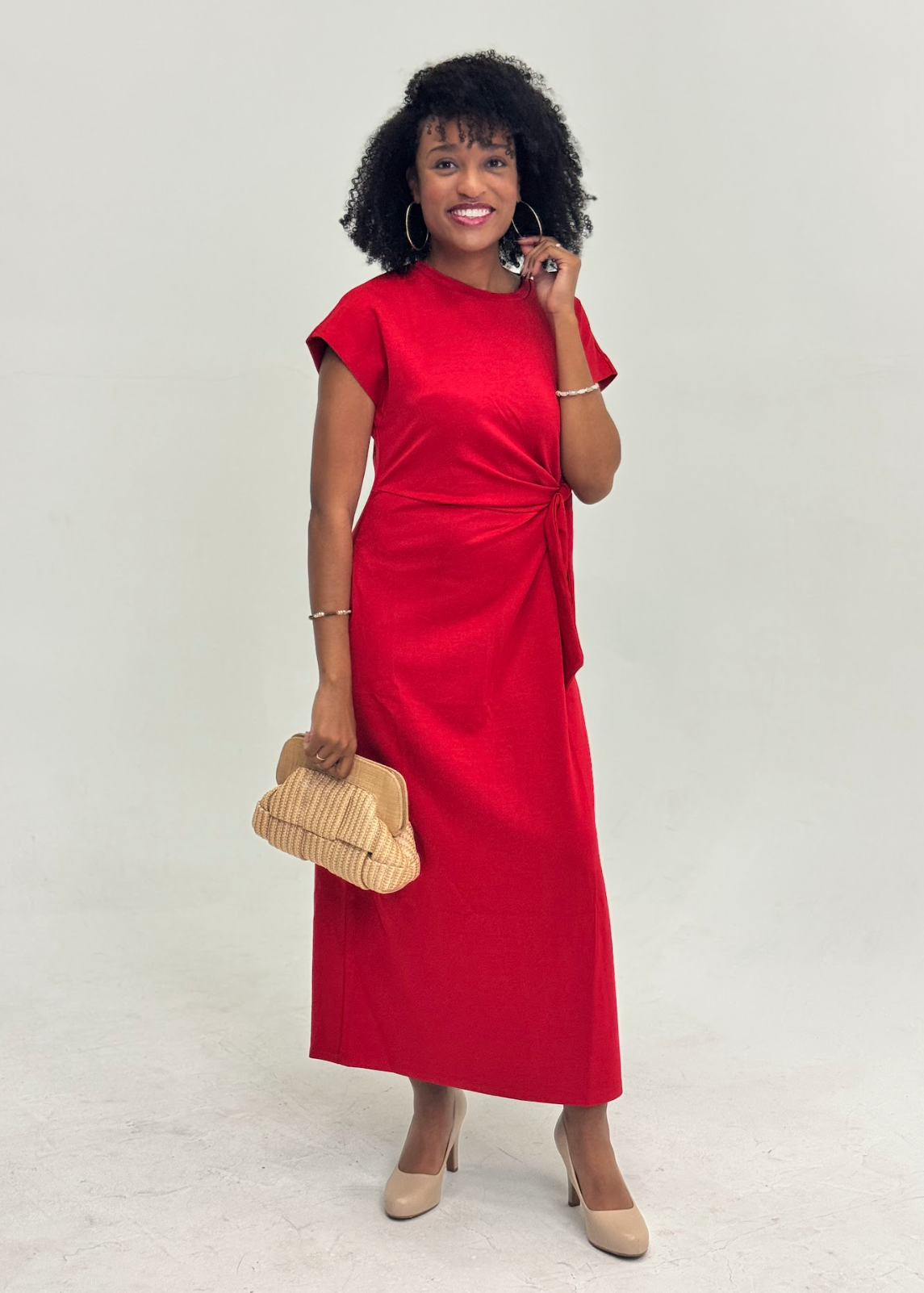 women wearing side tie red ankle length dress with cluth and heels