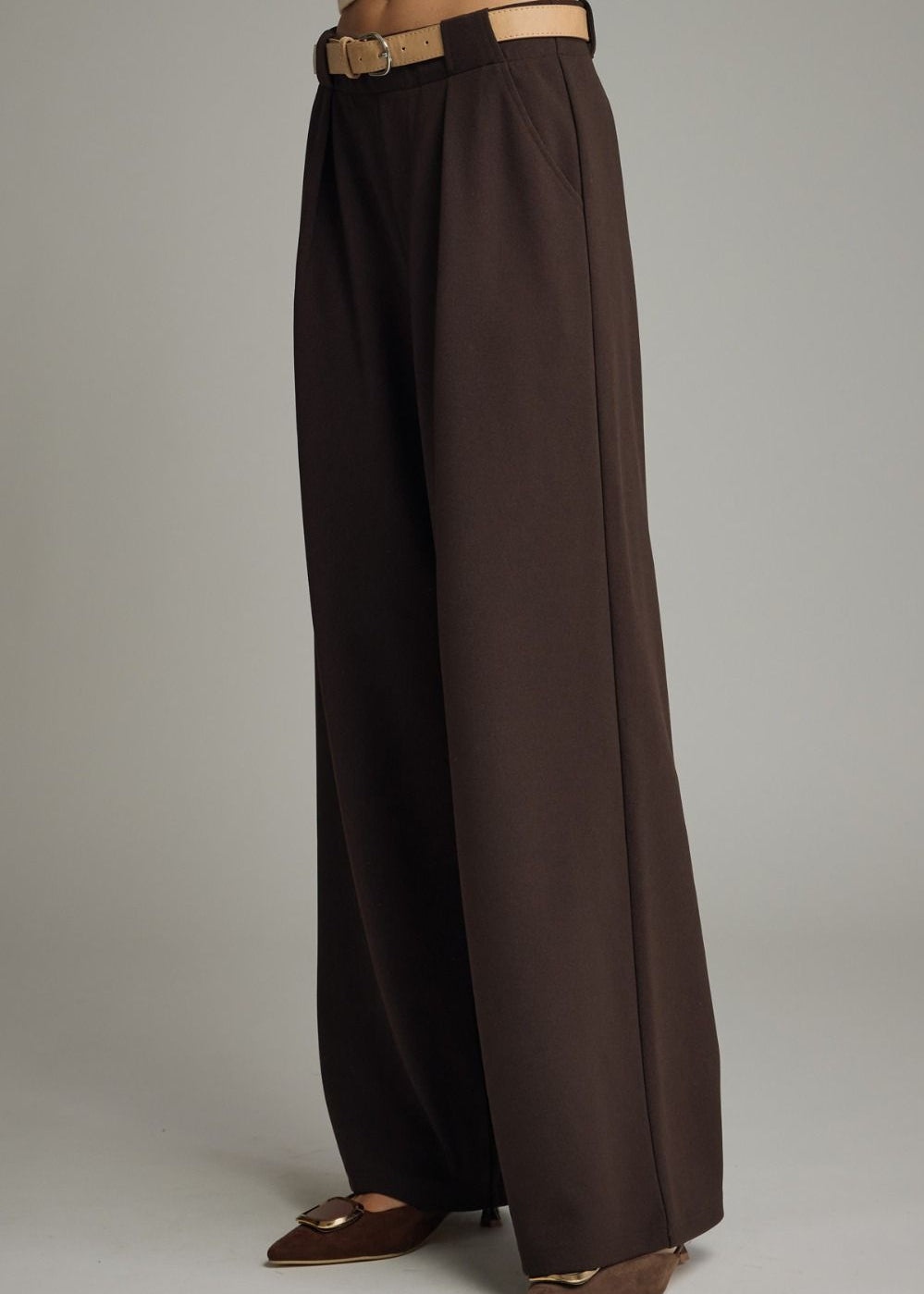 women wearing brown trouser side view