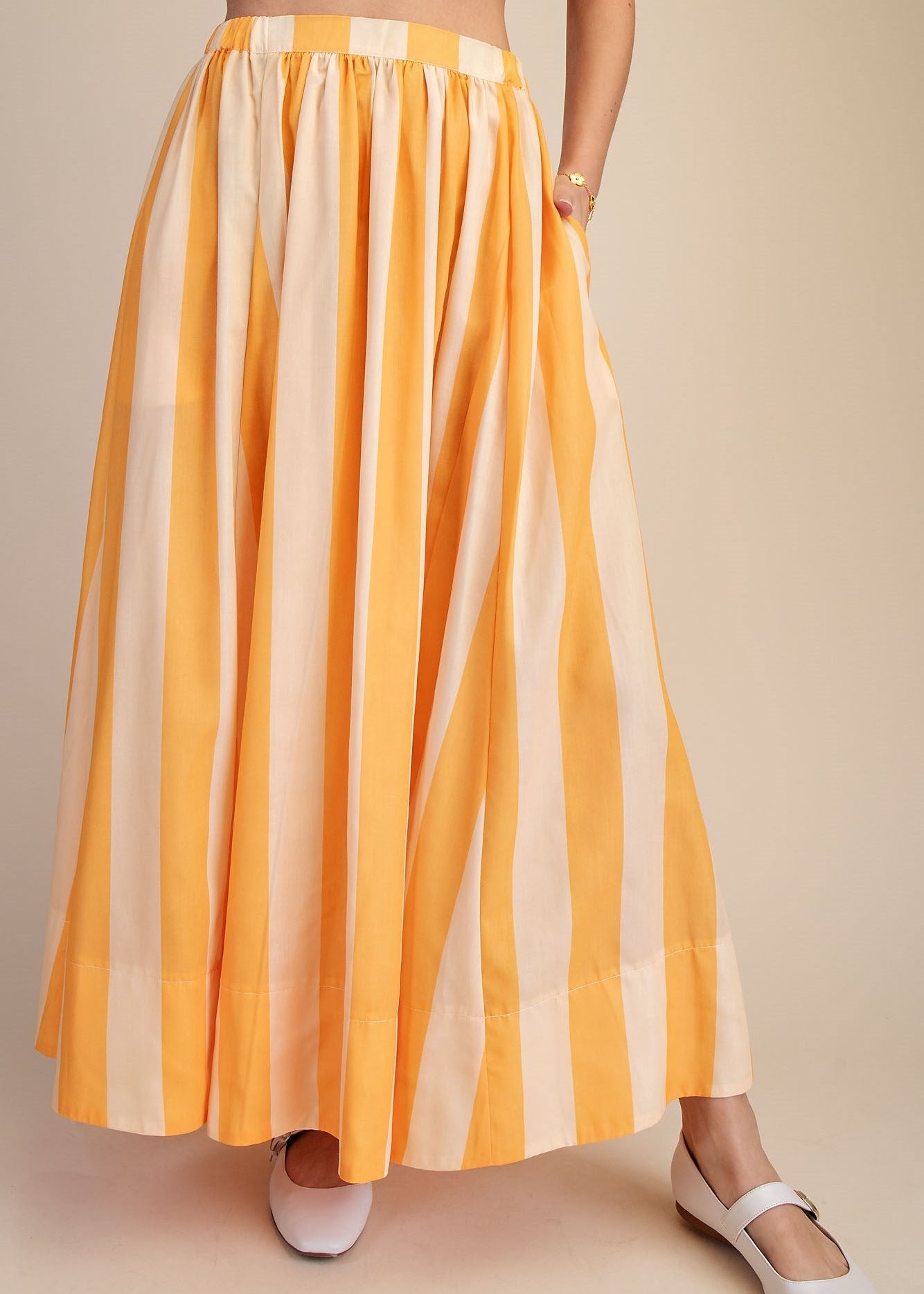 women wearing striped maxi dress

