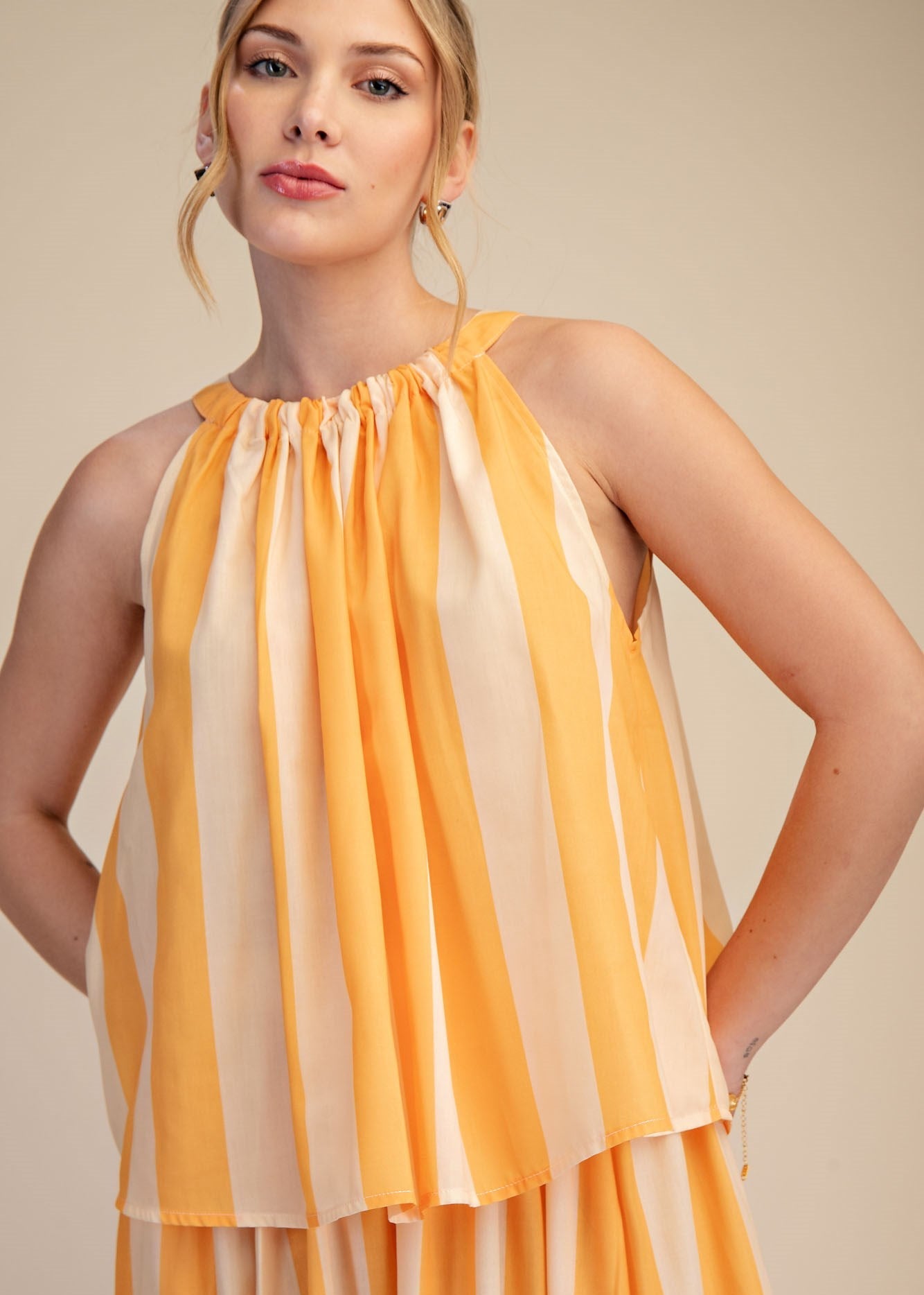 women wearing striped halter neck blouse