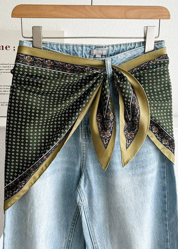picture of jeans with triangle scarf tied around the waist