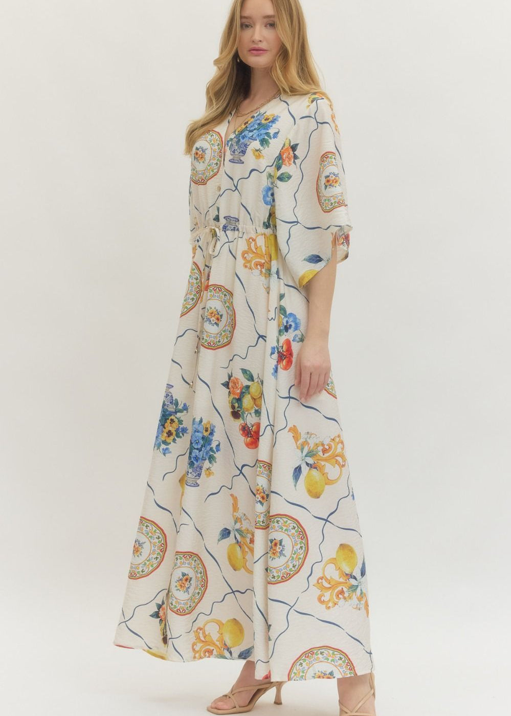 women wearing white printed dress maxi length