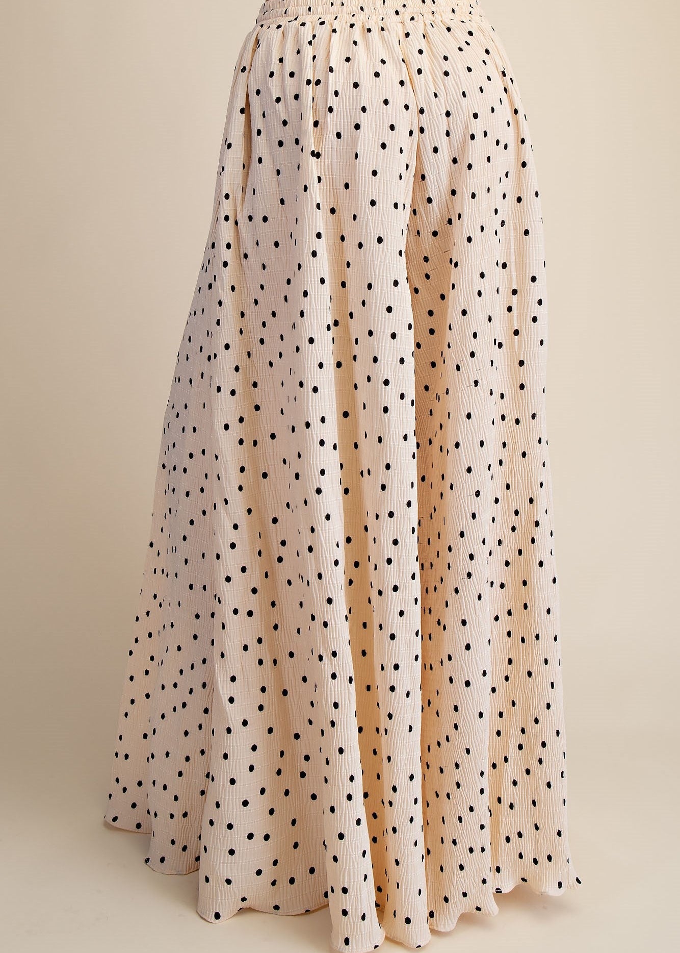 back side of women wering polka dot wide leg pants