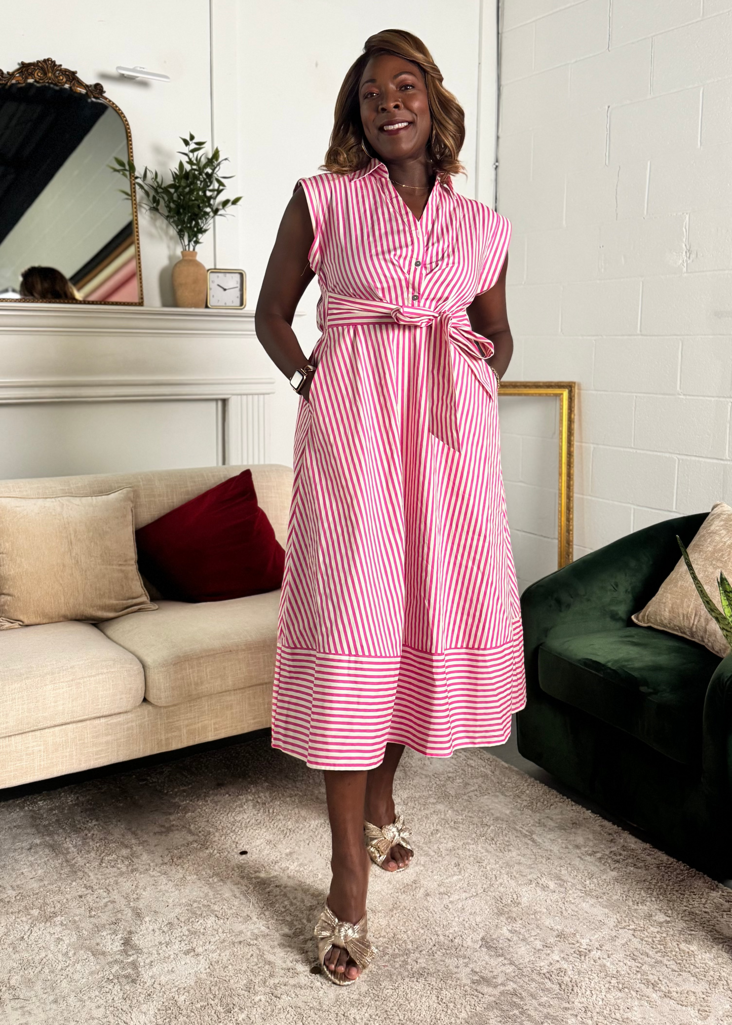 women wearing sleeveless dress with red and white striped fabric mid length