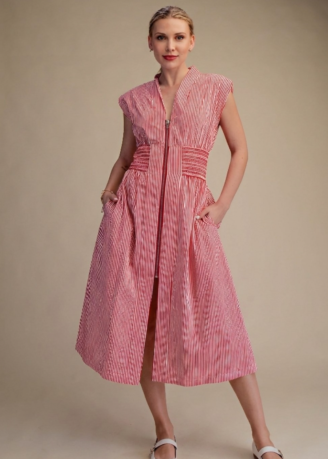 women wearing sleeveless zipper front stripped midi dress with flat close toe shoes 