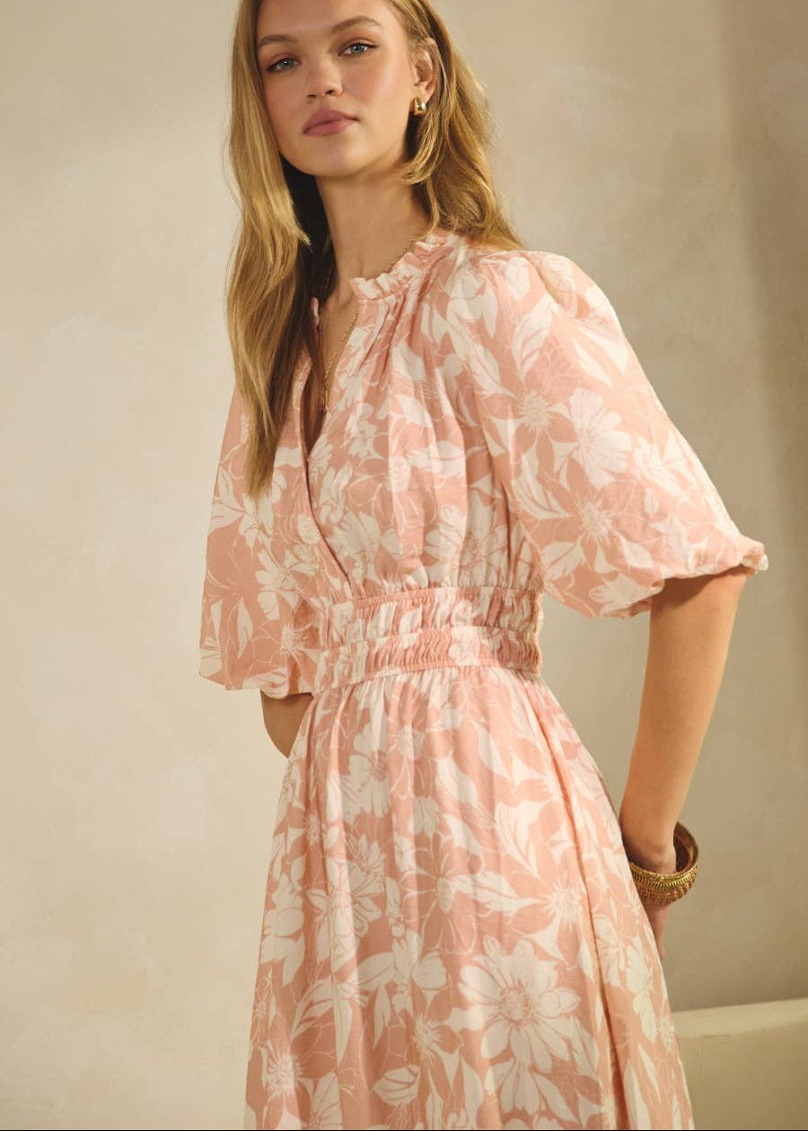 side view of women wearing bubble sleeve floral dress